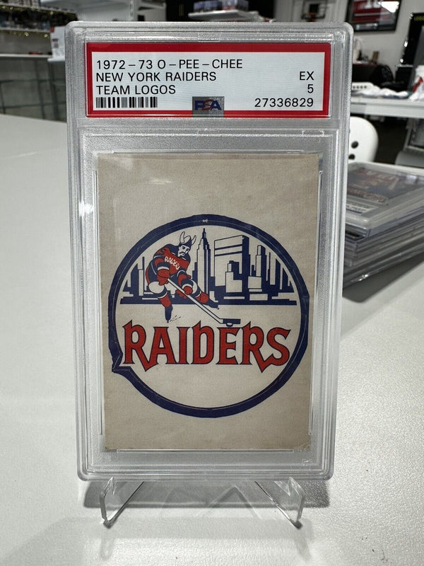 1972-73 O-Pee-Chee New York Raiders Team Logo PSA 5 - Cartes Sportives Rive Sud